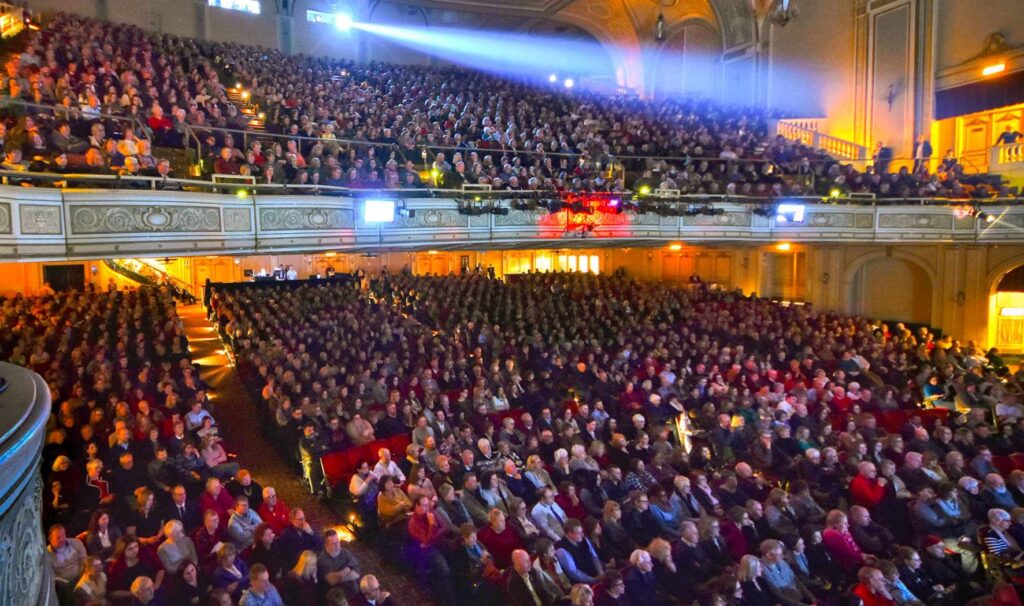 Audience in theatre seats