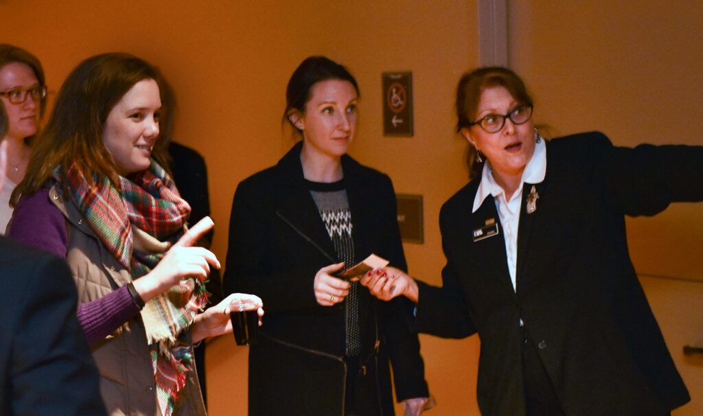 Volunteer helping patrons